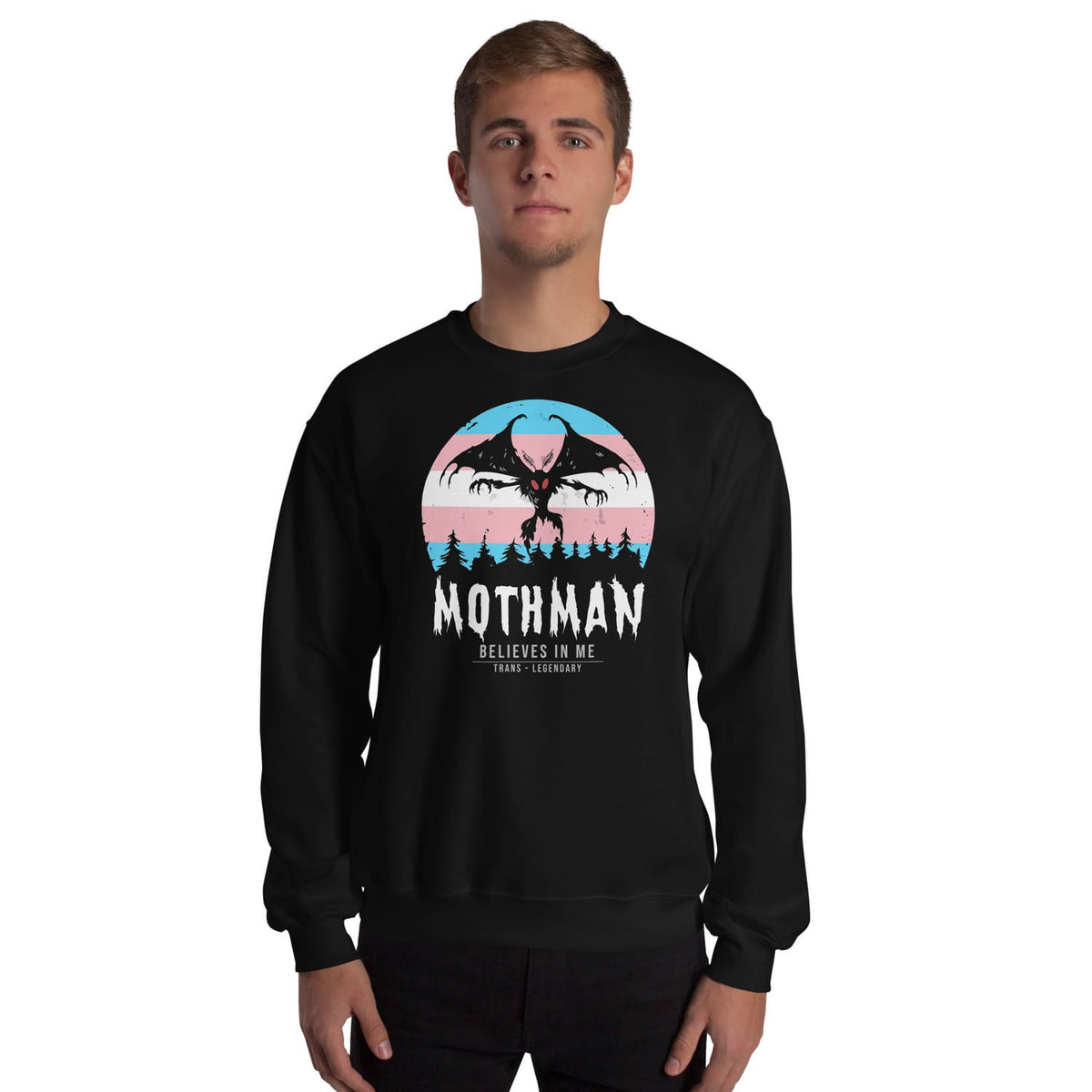 Transgender wearing a black sweatshirt with 'Mothman Believes in Me' graphic design on a white background