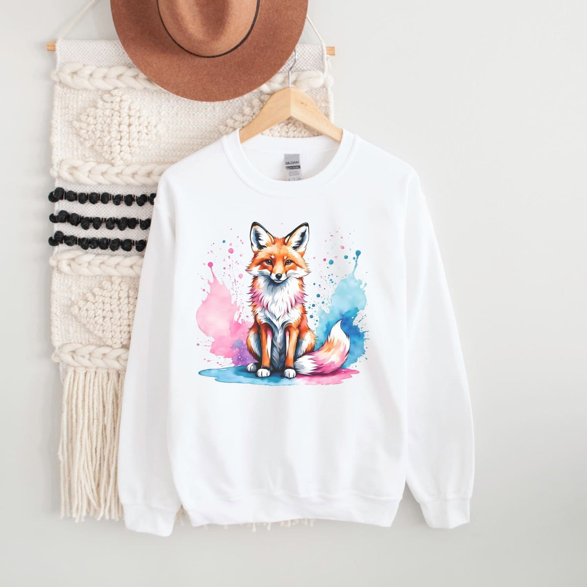 white trans pride sweatshirt hanging