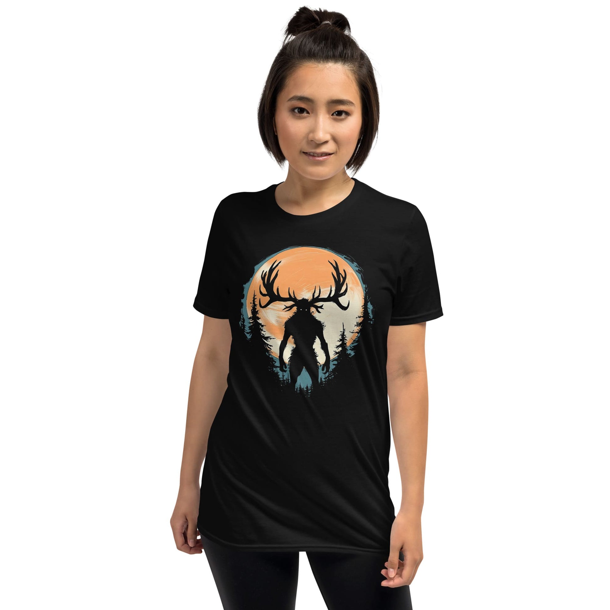 Person wearing a black t-shirt with a graphic design of wendigo silhouette against an orange and blue background.