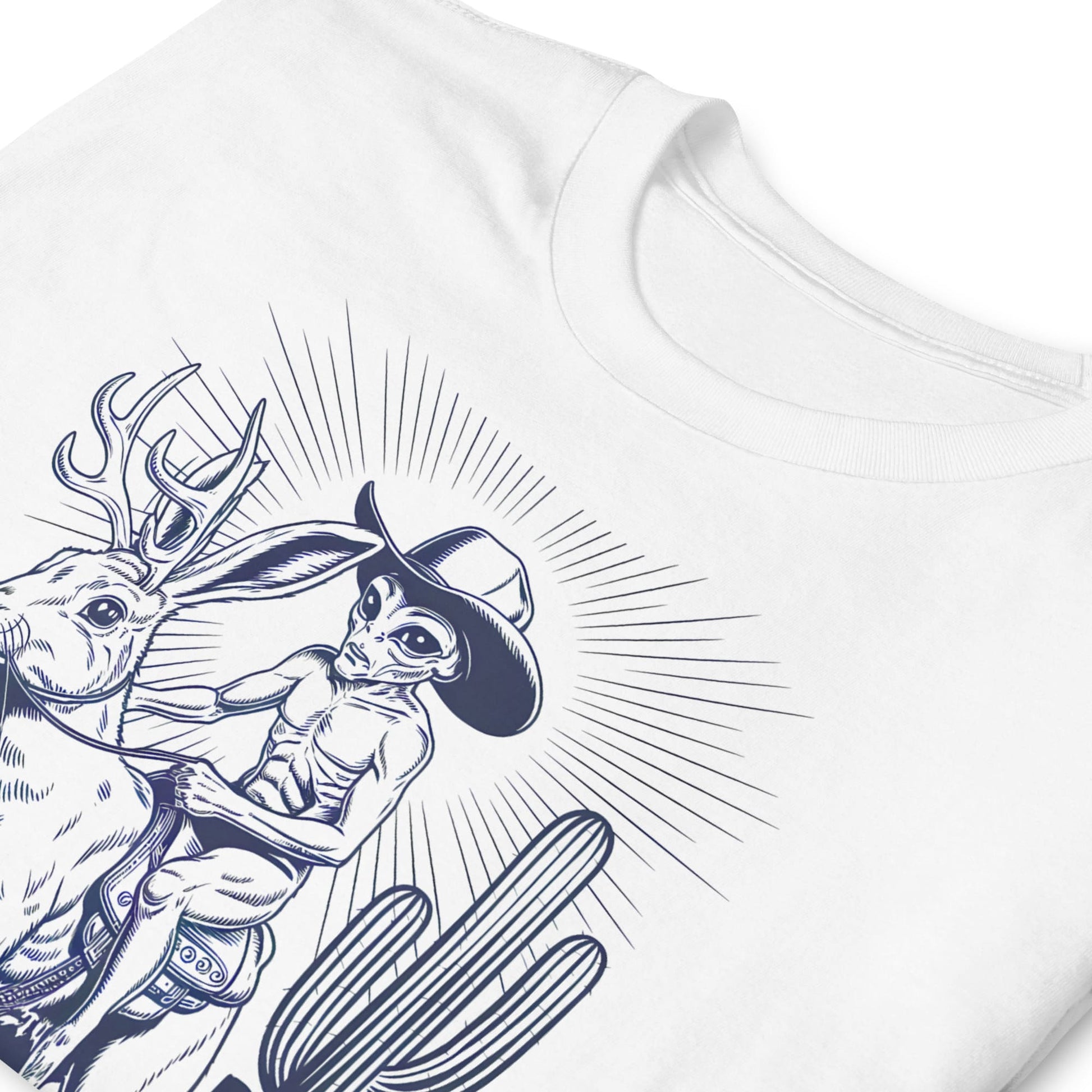 White t-shirt with black and white graphic design of a cowboy alien riding a jackalope
