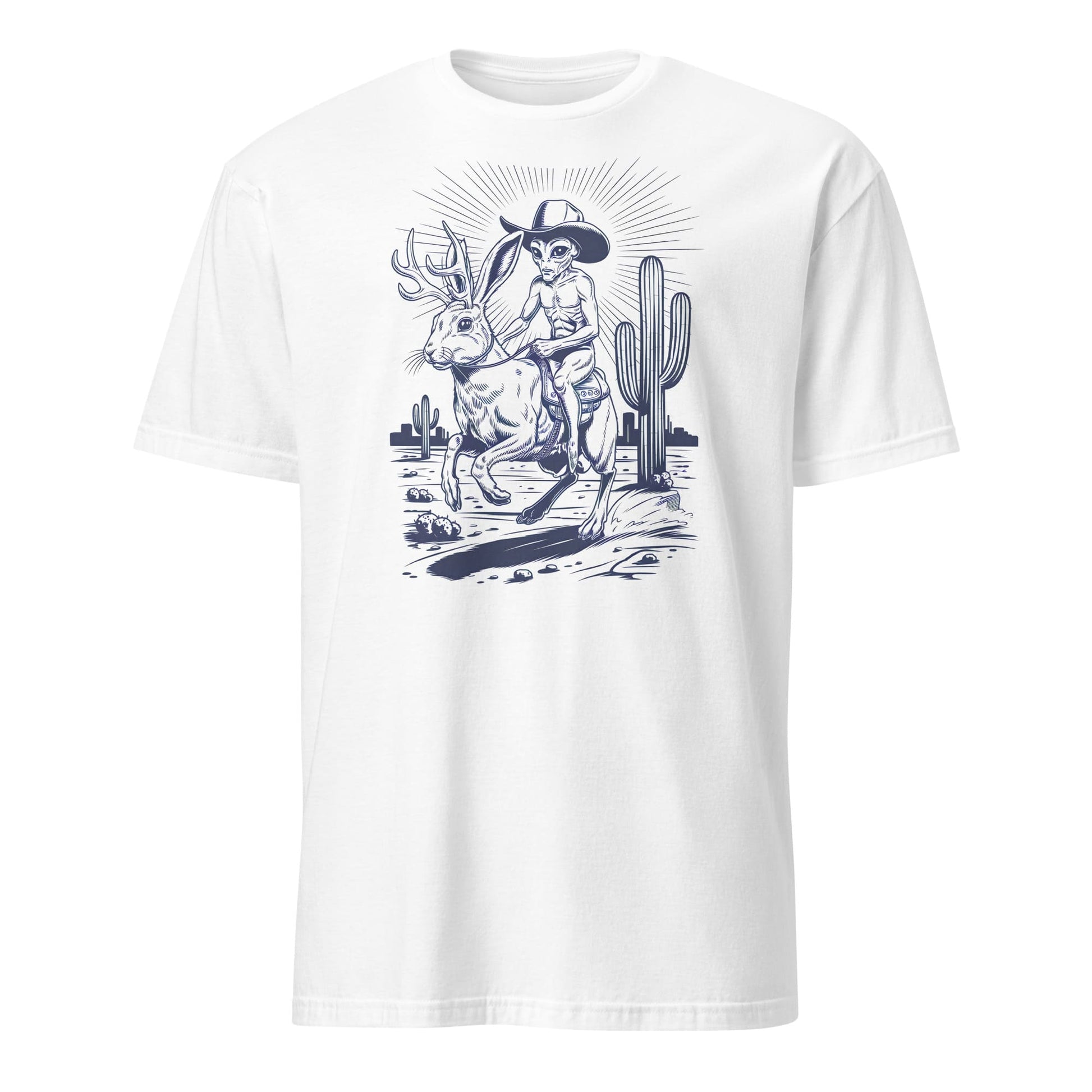 White t-shirt with a graphic design of aan alien riding a jackalope cryptid and a cactus in the background.