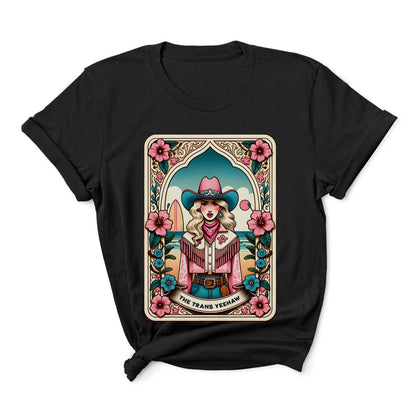 Black t-shirt with a colorful graphic of a woman in a cowboy hat and scarf, surrounded by flowers, on a white background: The Trans Yeehaw Tarot Card Shirt, Western MTF Subtle Transgender Pride Tee, Country Cowgirl T-Shirt, Rodeo Gift For Trans Daughter Sister