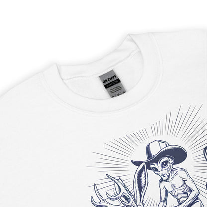 White t-shirt with alien wearing a cowboy hat riding a jackalope on a white background