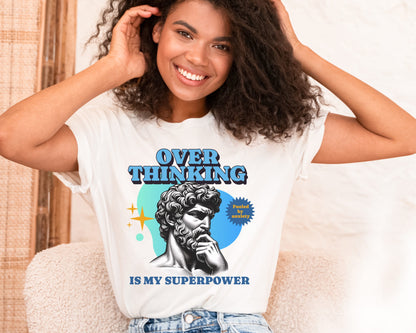 Woman wearing a t-shirt with a graphic of a statue and text 'Overthinking is my superpower': Funny Overthinking Shirt, Anxiety Tee For Autistic, Autism Awareness T-Shirt, Sarcastic Gift For Overthinker, Neurodiverse Tee Neurospicy