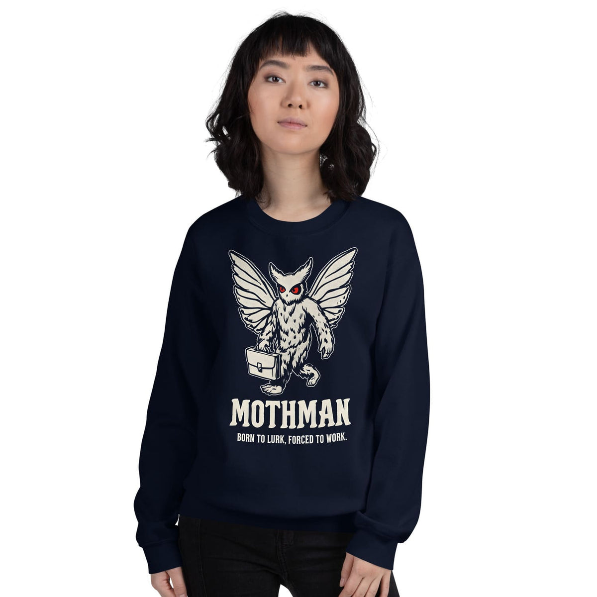 Person wearing a navy blue sweatshirt with Mothman graphic and text.