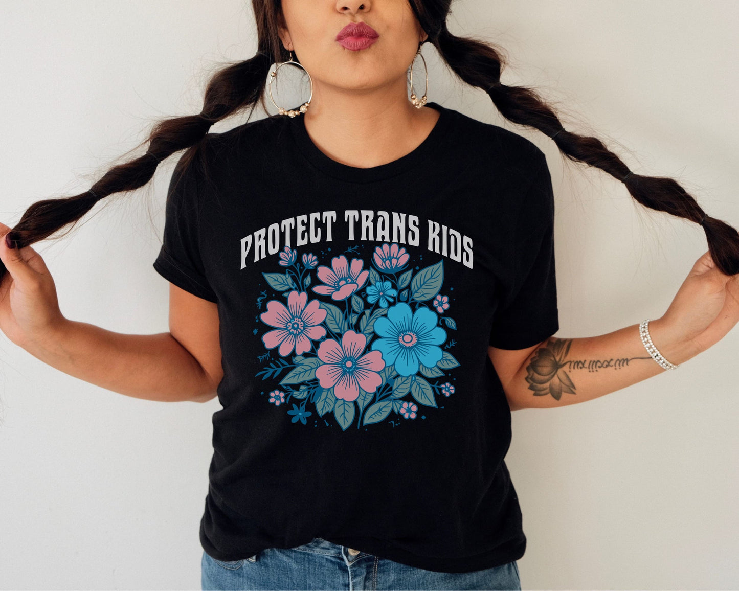 protect trans kids floral transgender shirt, in use