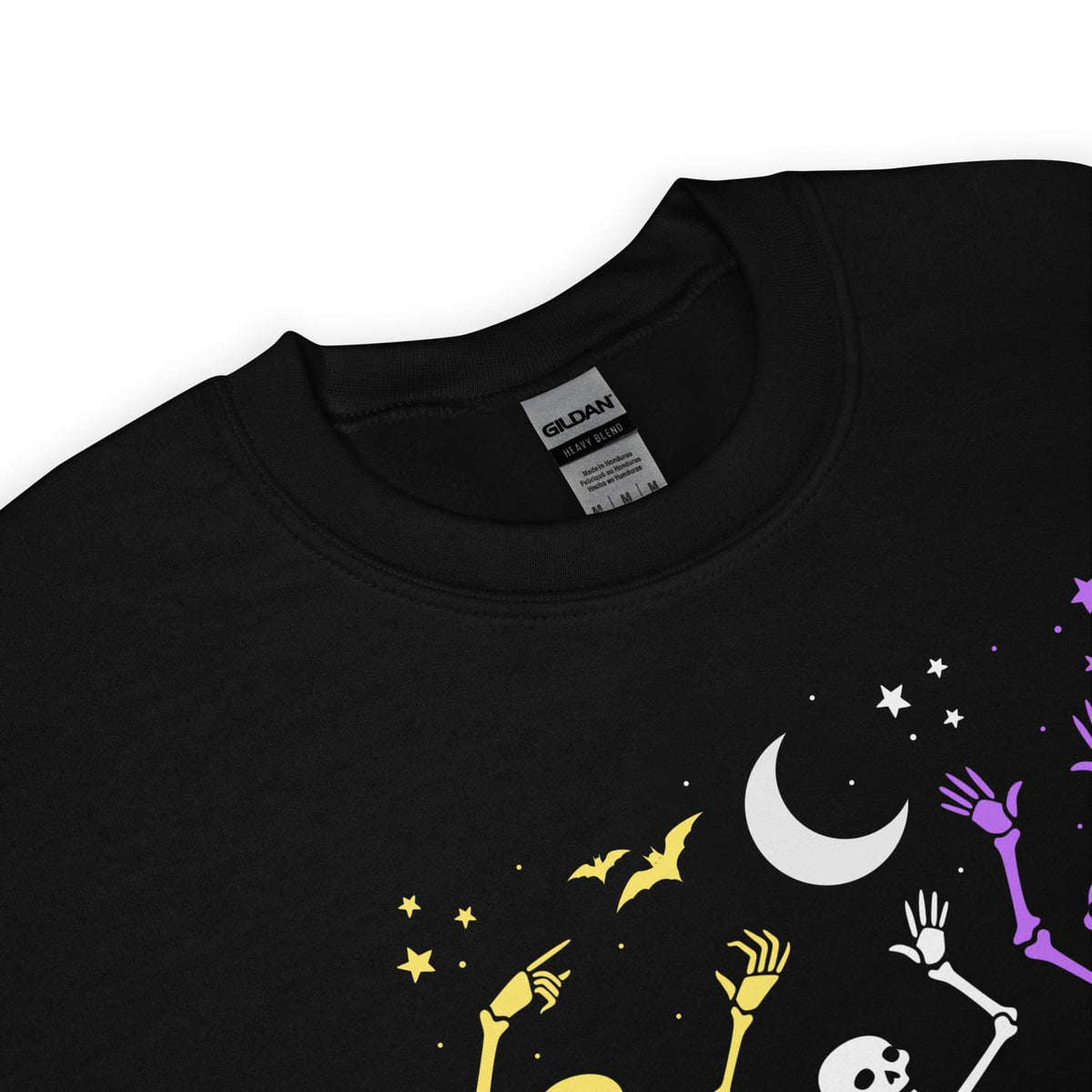 non binary Black t-shirt with Halloween-themed design featuring bats, stars, and skeletons on a white background.