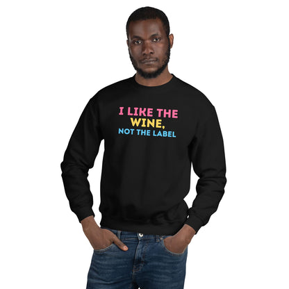 Man wearing a black pansexual sweatshirt with colorful text on a white background