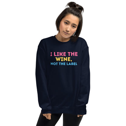 Person wearing a navy pansexual sweatshirt with colorful text on a white background